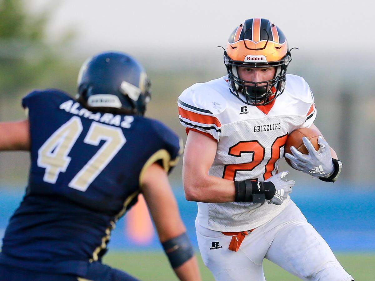 Fruitland’s Noah Hattrup (20) runs with the ball against Middleton.
