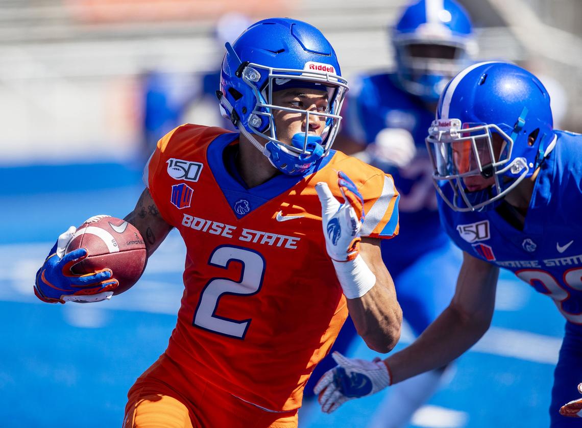 Boise State wide receiver Khalil Shakir finds running room after a pass during the Fall Fan Fest practice Saturday at Albertsons Stadium in Boise.