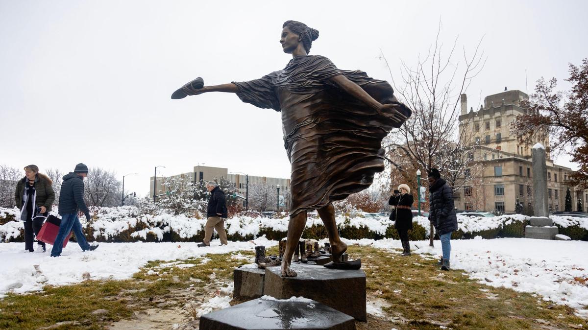 A new statue by artist Irene Deely titled “The Spirit of Idaho Women” is unveiled in a ceremony on the grounds of the Idaho Statehouse on Dec. 12. The piece commemorates the women’s suffrage movement and the passing of the 19th Amendment. The statue symbolizes the footsteps of women throughout America’s history culminating with a woman handing her shoe to the next generation.