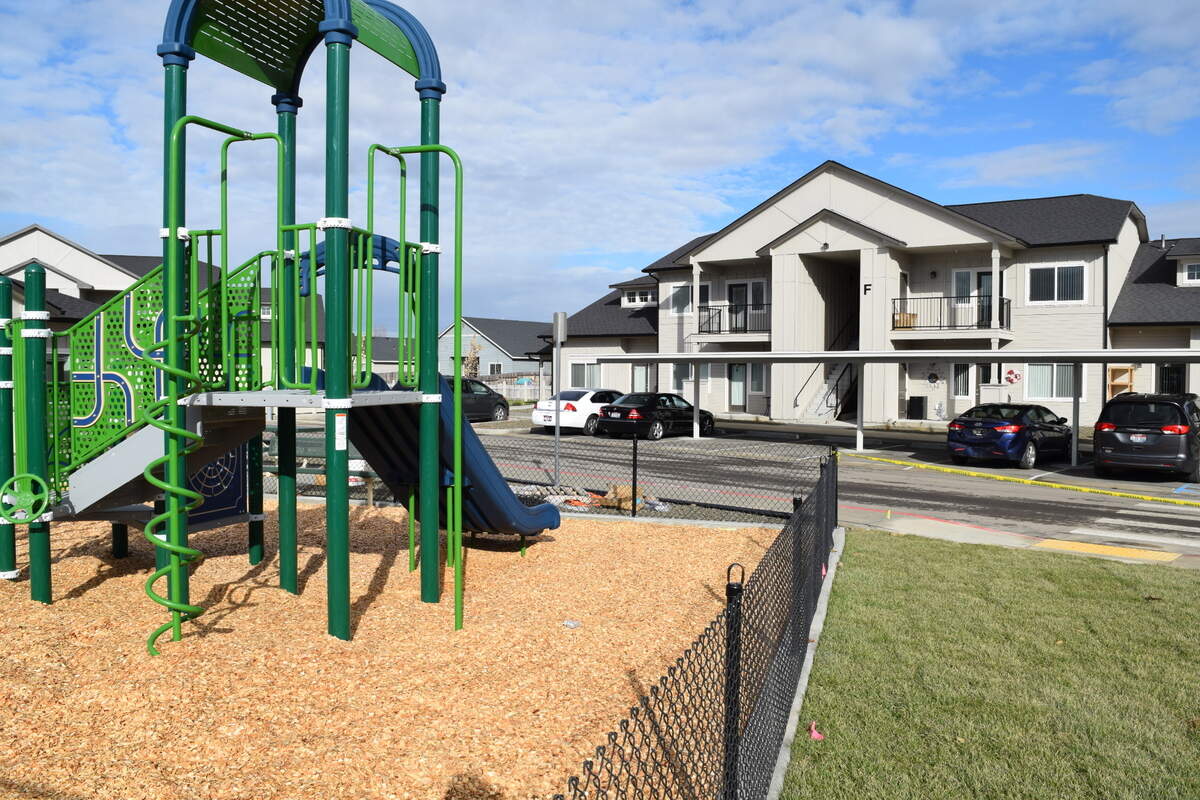 A children’s play structure at the new Wood Rose Apartments.