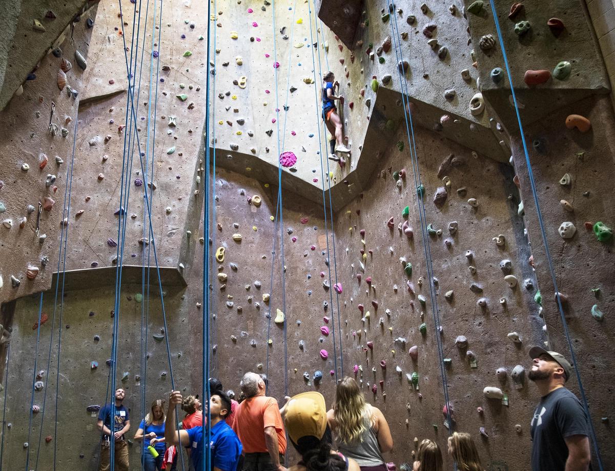 Volunteers help people with disabilities learn how to rock climb at an event sponsored by Boise company Coyote Prosthetics Saturday, Aug. 10, 2019 at the Boise State Student Recreation Center.