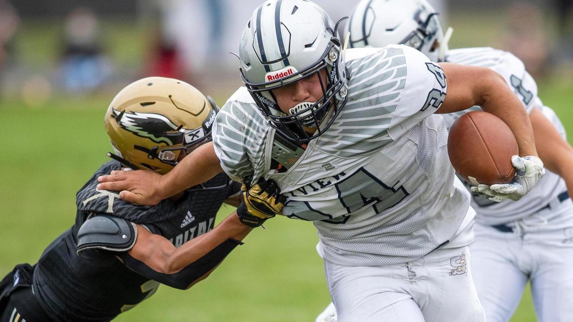 Skyview running back Atonio Fifita plows ahead to convert on fourth down last season at Capital.