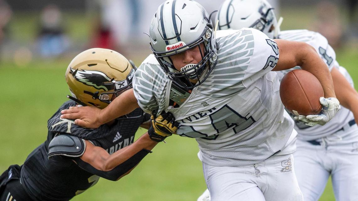 Skyview running back Atonio Fifita fights for yardage Sept. 25 at Capital. Fifita and the Hawks can clinch a 5A state playoff berth Friday with a win over Kuna. Lose, and it gets interesting.