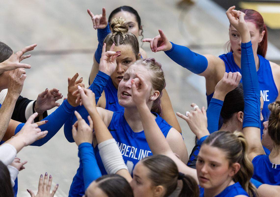 Timberline players make the wolf sign during a timeout in their match against Madison in the 6A state volleyball tournament Friday at Capital High School.