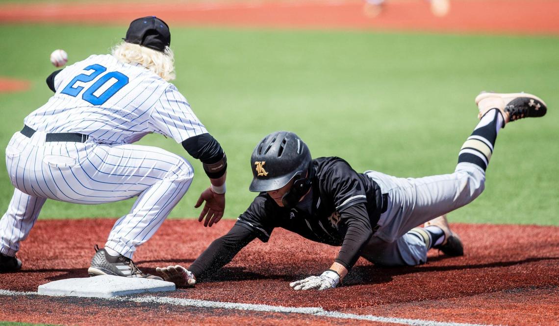 Kuna’s Aiden Harrington, right, slides safely back into first base after the Kavemen made a surprise run to the 5A state tournament last year.