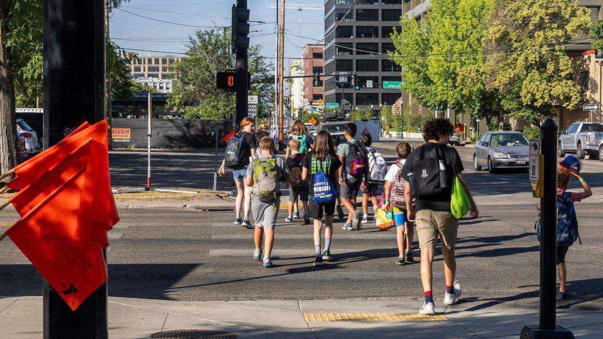 Timing of the stop lights has been adjusted so pedestrians are crossing while vehicles are at a stop at the intersection of 11th and State streets near the Downtown Boise YMCA. New signage alerts drivers turning left or right to yield to pedestrians.