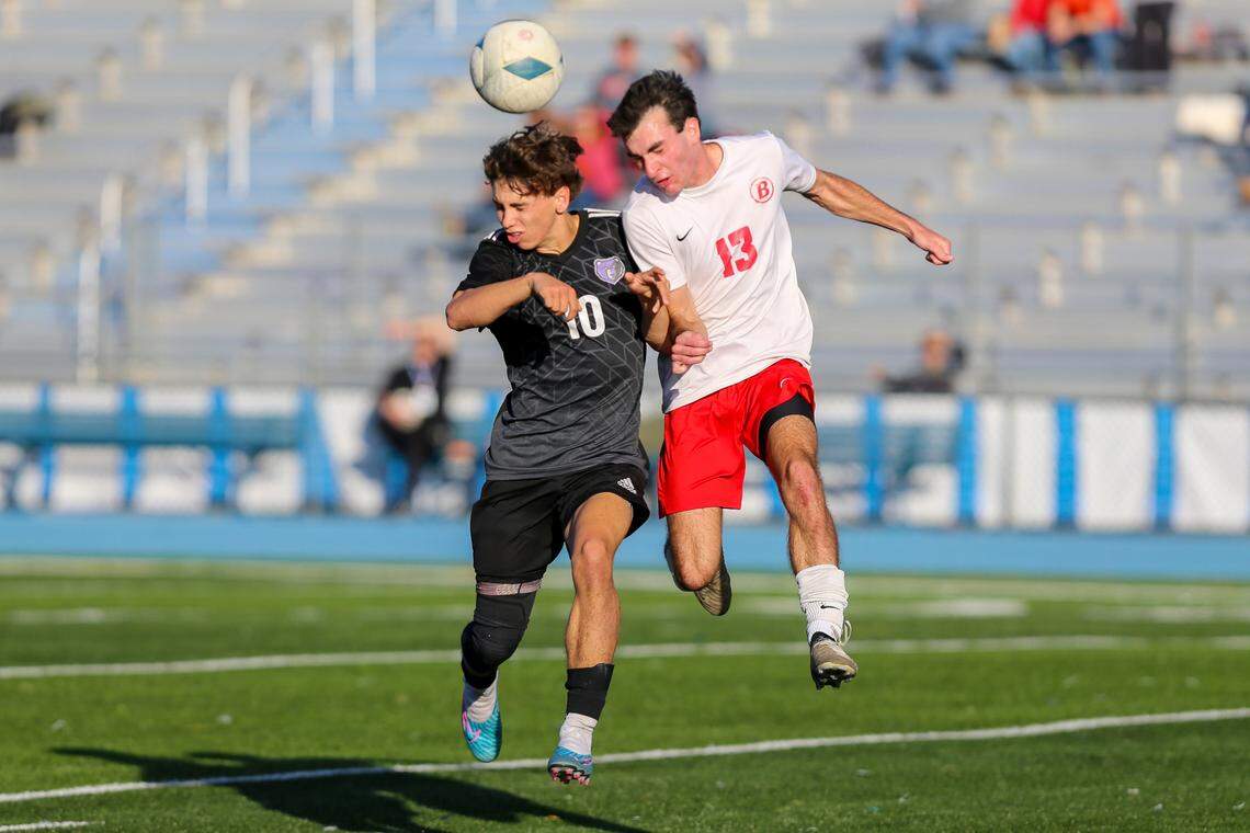 Rocky Mountain’s Rylan McPherson, left, and Boise’s Ben Colborn try to head the ball in the 6A boys soccer state championship game Saturday at Coeur d’Alene High School. Boise won 1-0 in overtime.
