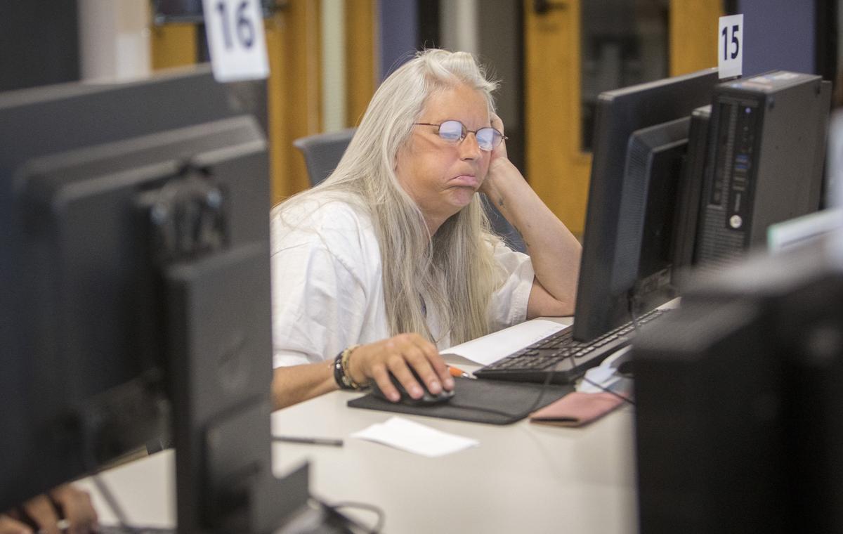 Traci Foy, who became homeless when her rent spiked, spends many afternoons at the Downtown public library searching for apartment listings. There are few she can afford, that are near public transportation and close to doctors and case managers.