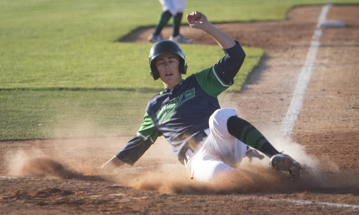 Mountain View’s Matthew Reynolds slides home safely in last year’s district championship series. Reynolds has committed to play at Northwest Nazarene next year.