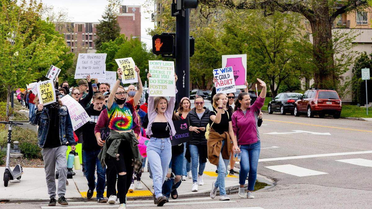 People attending Planned Parenthood’s Bans Off Our Bodies rally march in downtown Boise for abortion rights on Saturday, May 14, 2022.