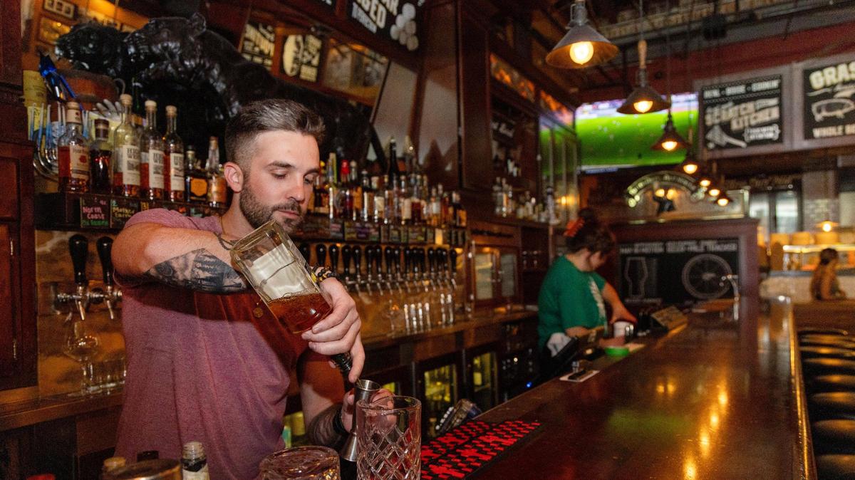 Bartender Johnny Blank makes a drink at Bittercreek Alehouse on North 8th Street in downtown Boise, Friday, June 16, 2023. A new Idaho law taking effect in July bans selling or leasing liquor licenses.