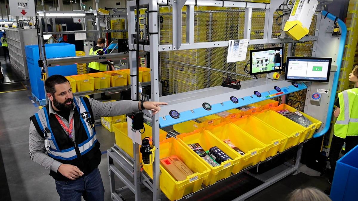 Auston Ayres, site leader at Amazon’s new same-day delivery site in Nampa, called SID1, describes how packages are moved through the system.