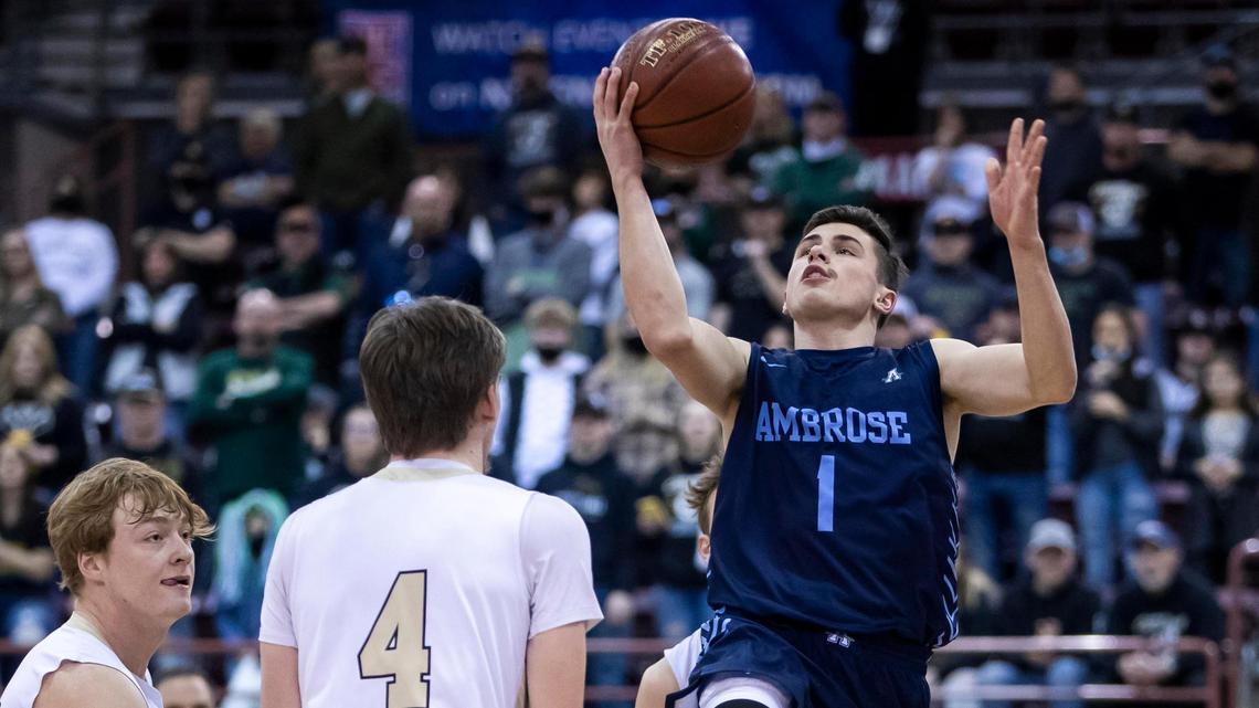 Ambrose guard Johnny Sugarman scores on a baseline layup against St. Maries in the 2A state championship March 6 at the Ford Idaho Center in Nampa.