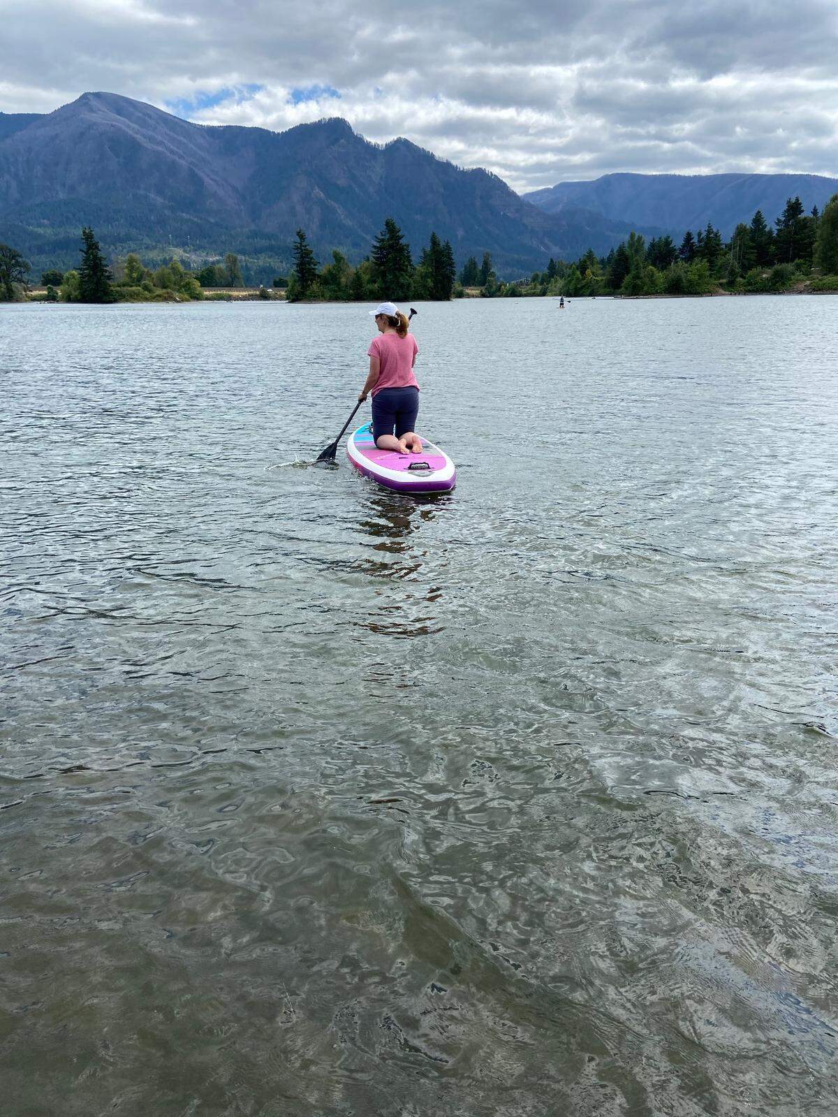 Heidi Naylor paddleboards at Rock Cove in Washington.