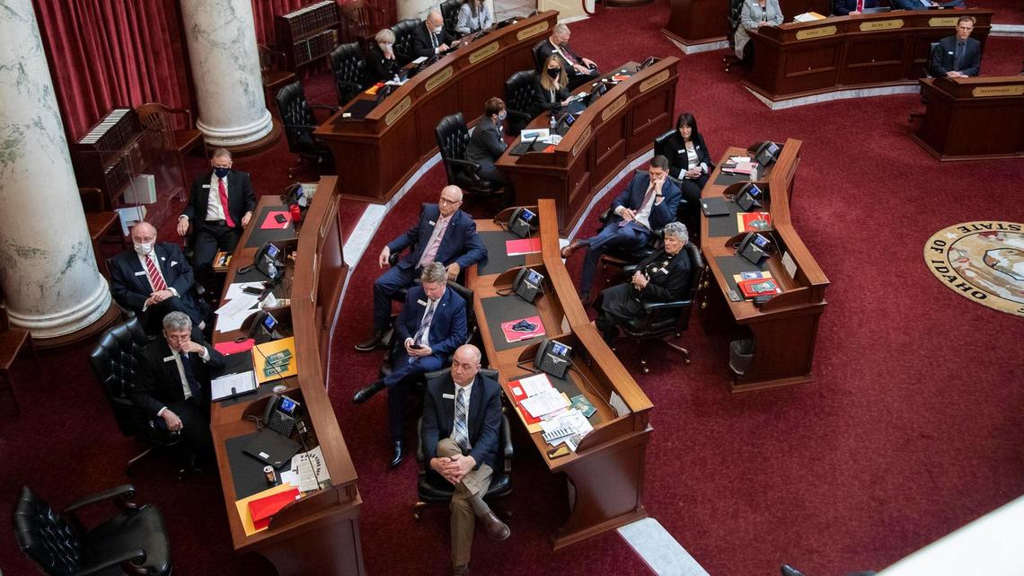 Idaho Senators watch a virtual State of the State address from Gov. Brad Little on the Senate floor Monday, Jan. 11, 2021 at the Statehouse in Boise.
