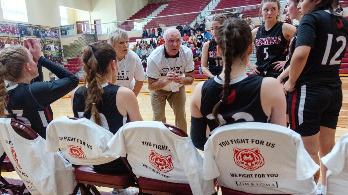 Assistant girls basketball coach Randy Fisk and his wife Karri Fisk coach the Greenleaf Friends Academy team in its 1A Division I girls basketball state tournament game against Prairie on Thursday at Columbia High School. It was the first game the team played since the car crash last week that killed assistant coach Loma Bittick and hospitalized head coach Jim Bittick.