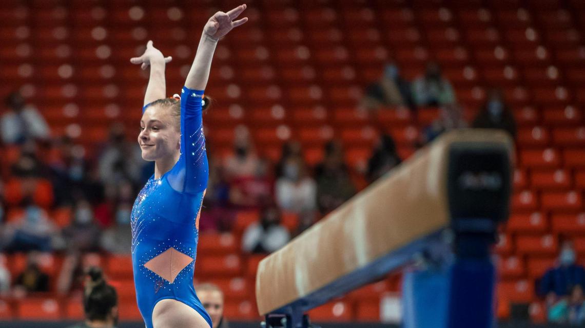 After completing her balance beam routine and dismount, Boise State gymnast Talia Little raises her arms for the judges and Bronco fans at BSU’s home opener against No. 20 Southern Utah on Friday at ExtraMile Arena.