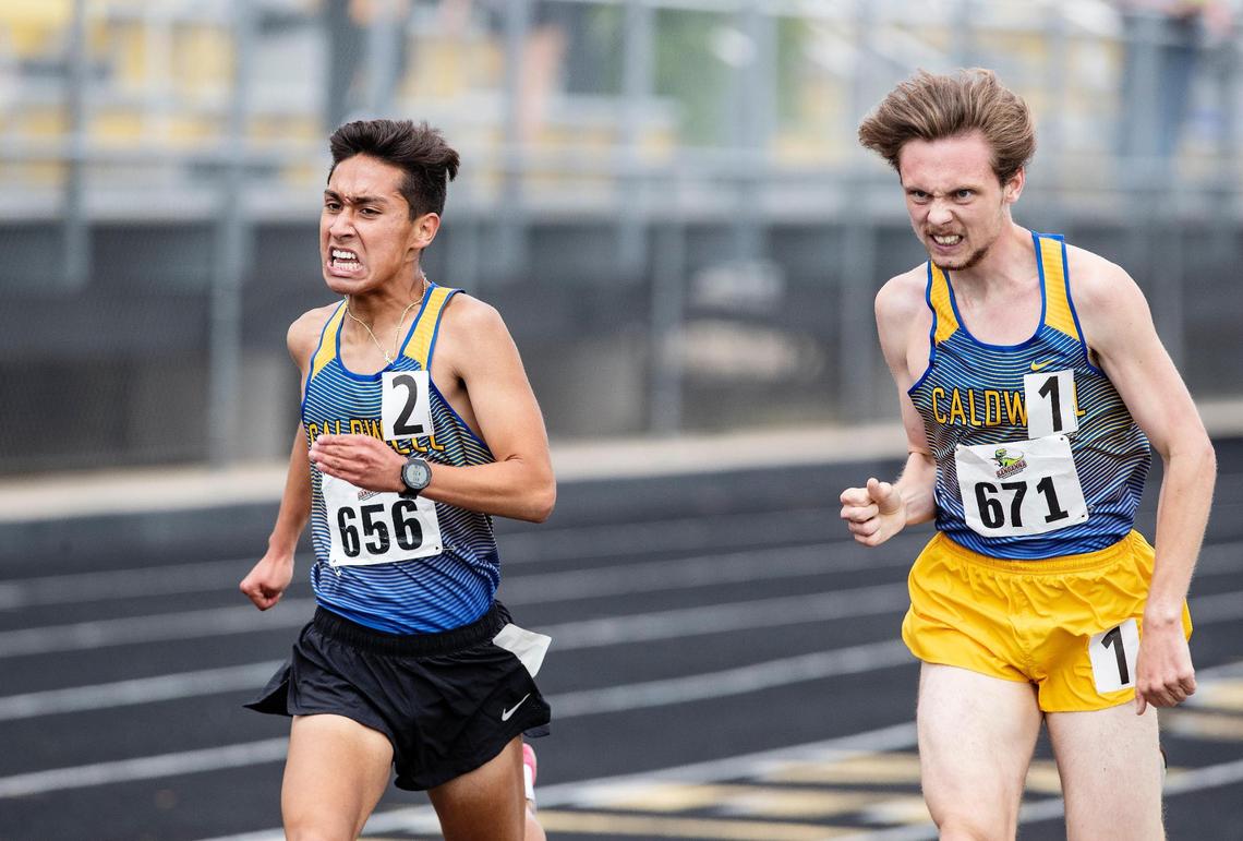 Caldwell’s Cruz Flores passes teammate Cyress Wilson for first place on the final lap of the 1,600 meters during the 4A District Three track and field championships at Bishop Kelly High on Saturday, May 15, 2021.