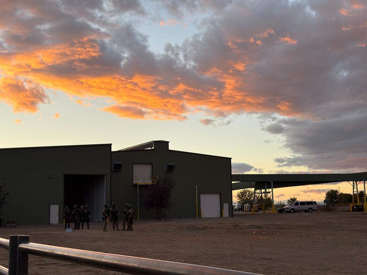 Members of law enforcement continued to stand outside La Catedral Arena in Wilder at sunset after the crowd dispersed.