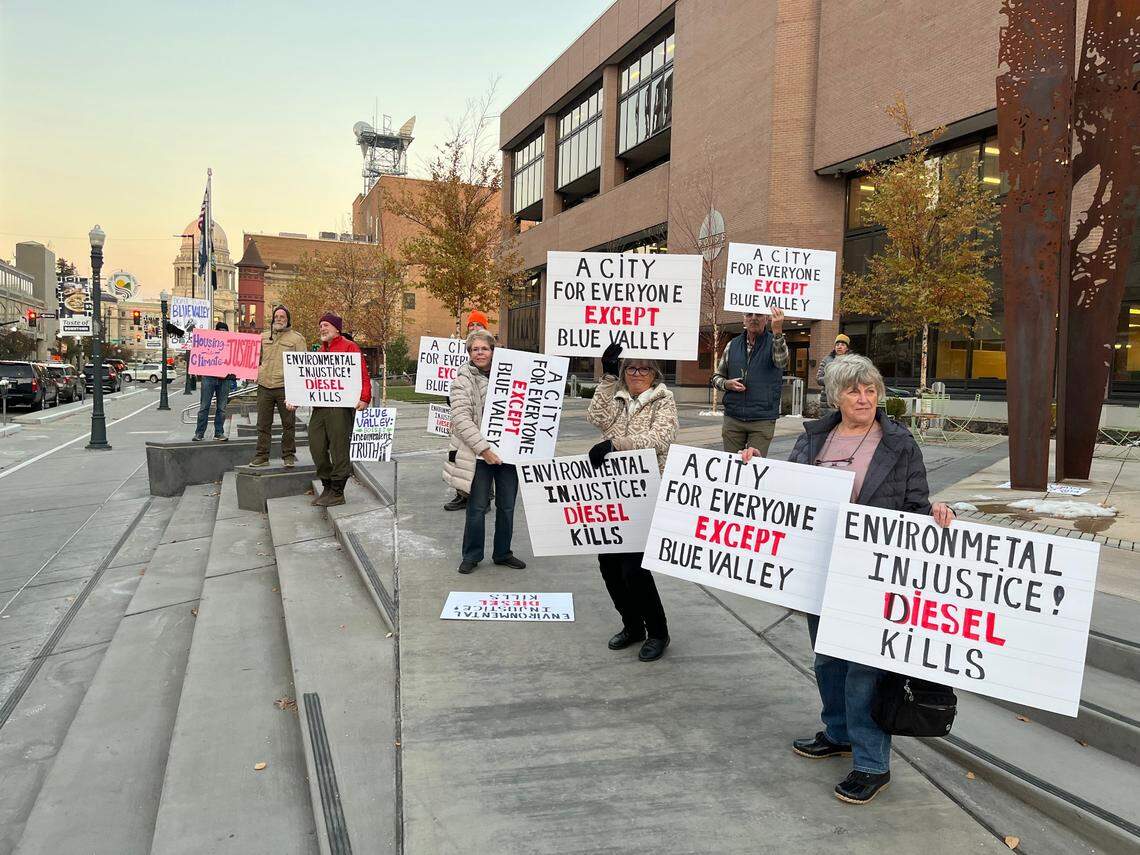Residents and supporters of the Blue Valley neighborhood, in Southeast Boise, demonstrate before a Tuesday City Council meeting.