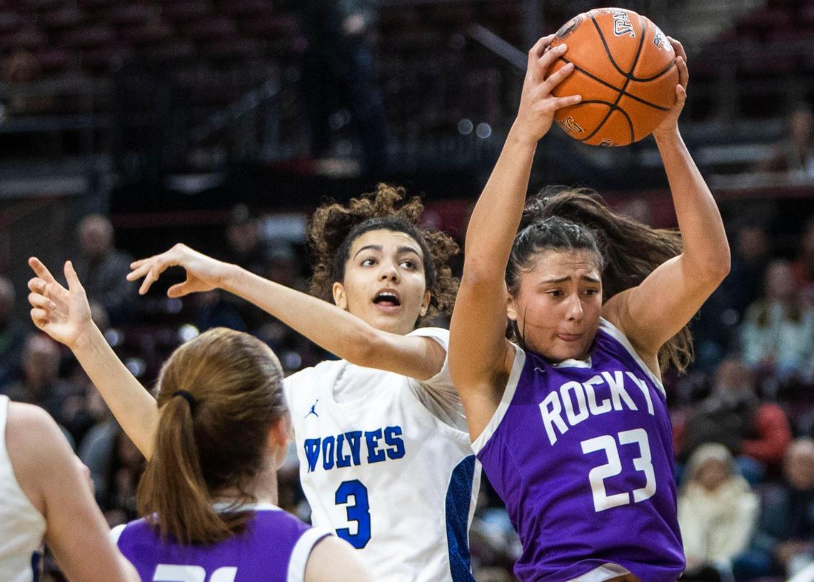 Rocky Mountain’s Cianna Legaspi grabs a rebound away from Timberline’s Emmi Swillie in the 5A state semifinals last season. Both return as two of the top players in the Treasure Valley this season.
