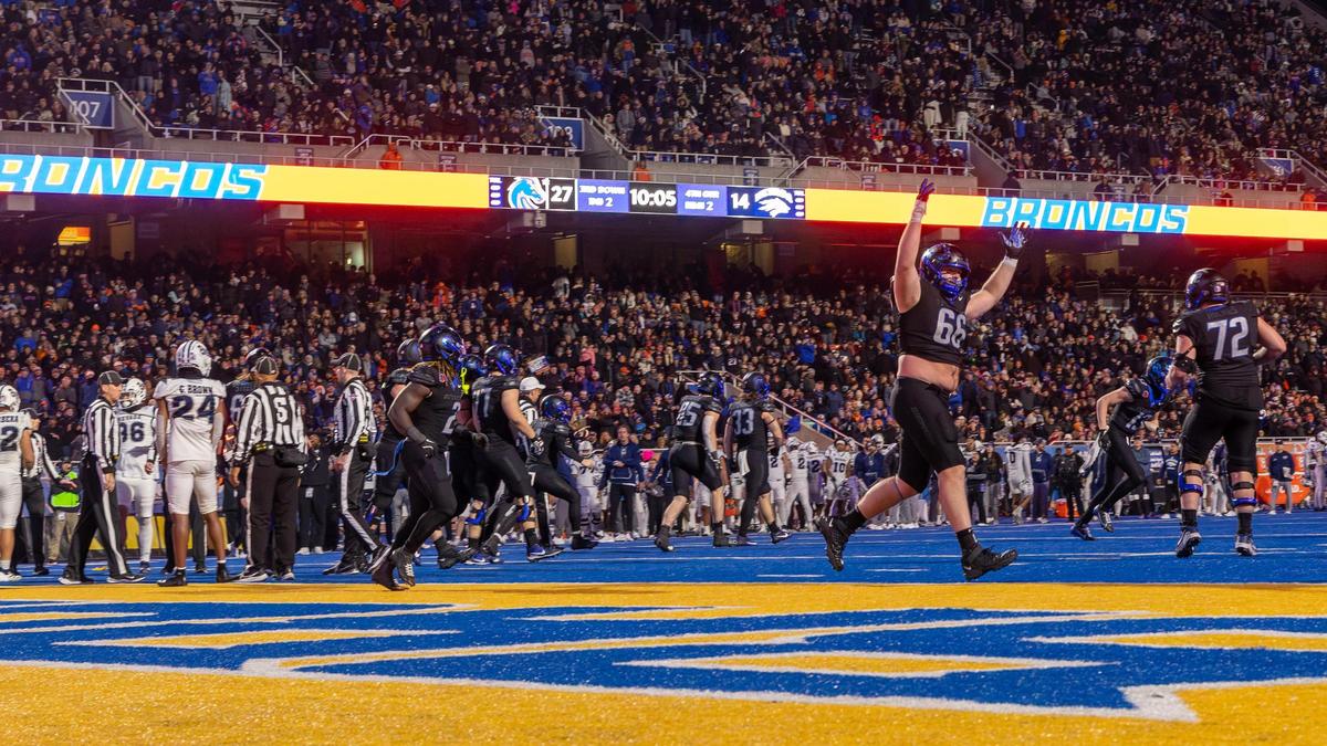 Former Boise State offensive lineman Ben Dooley celebrates a touchdown against Nevada last season.