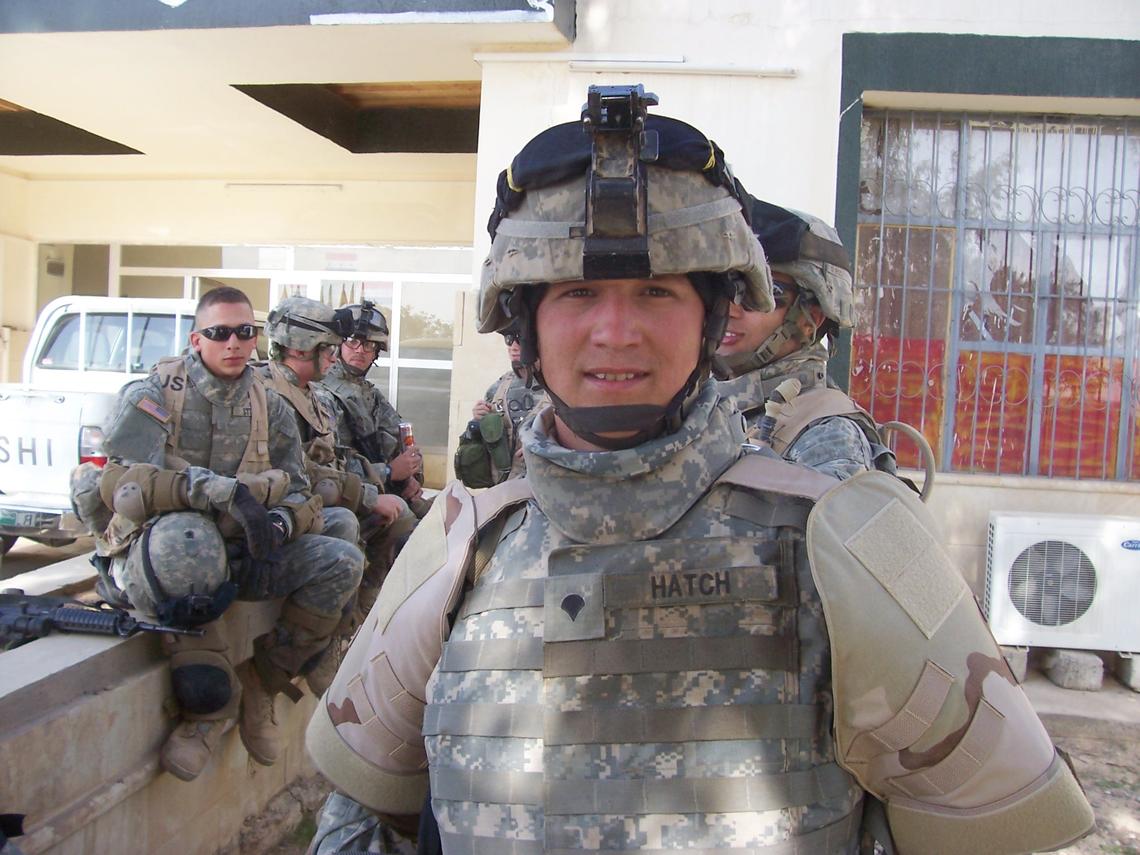 “As a gunner on the top of a Hummvee we had to wear extra gear on our upper half to protect us due to being exposed on top,” said Jared Hatch. He and his crew wait for a mission briefing after a raid. “We were tipped off that there was a weapons cache being hidden in the cement factory in our area. We performed a search of all the structures and tunnels and did not find any weapons at that time but less than a mile from there, a month later, we found the biggest weapons cache in the area since the beginning of the occupation.”