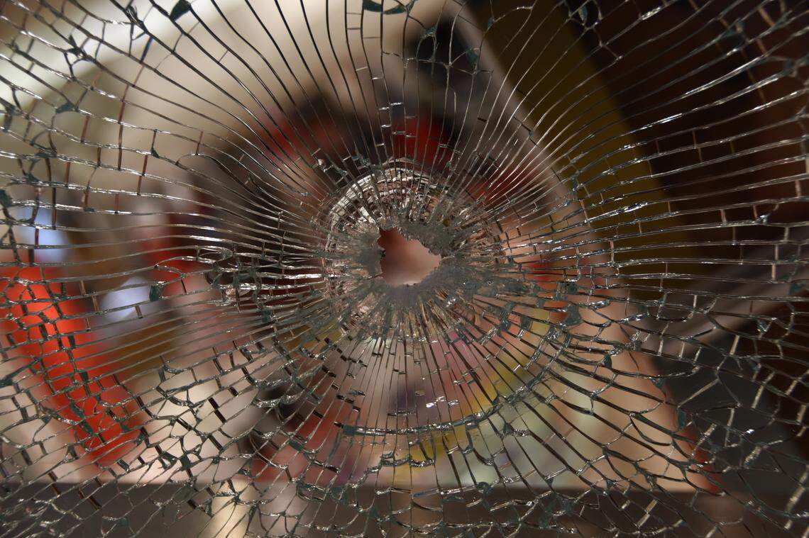 A hole in glass found at the scene of the Boise Towne Square Mall shooting in October 2021.