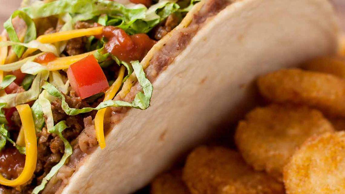 A soft shell smeared with refried beans, then wrapped around a hard shell taco? The inarguable fast-food genius that is called a Taco Bravo. (With Potato Oles on the side.)