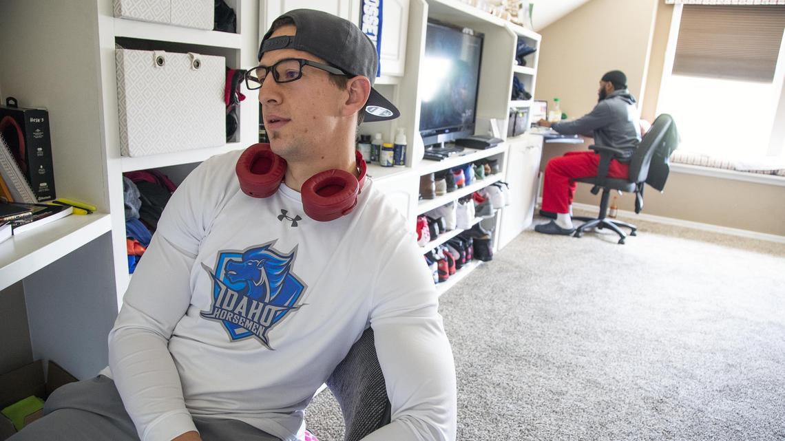 Idaho Horsemen cornerback Cooper Smith studies for a college test during some downtime at his host family home. Smith shares an upstairs loft with teammate Abraham Logan, also a corner back, at the home of host Sharon Knipe in South Boise.