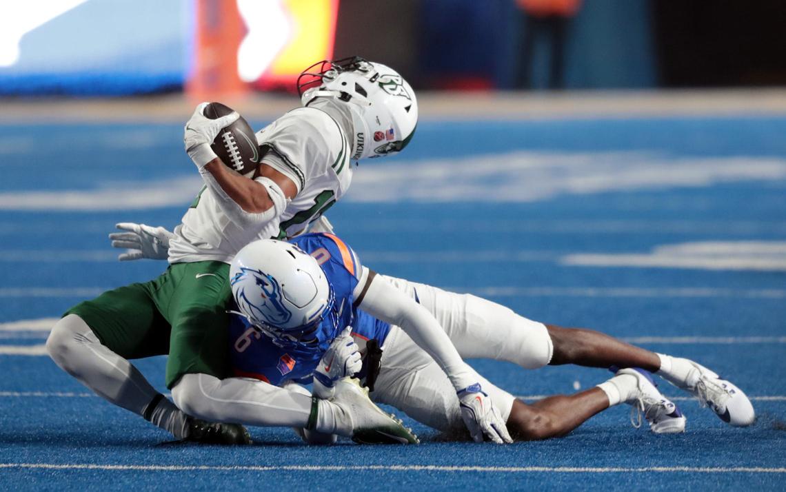 Boise State cornerback Jeremiah Earby collapses Portland State wide receiver Quincy Craig on a first-half play Saturday night.