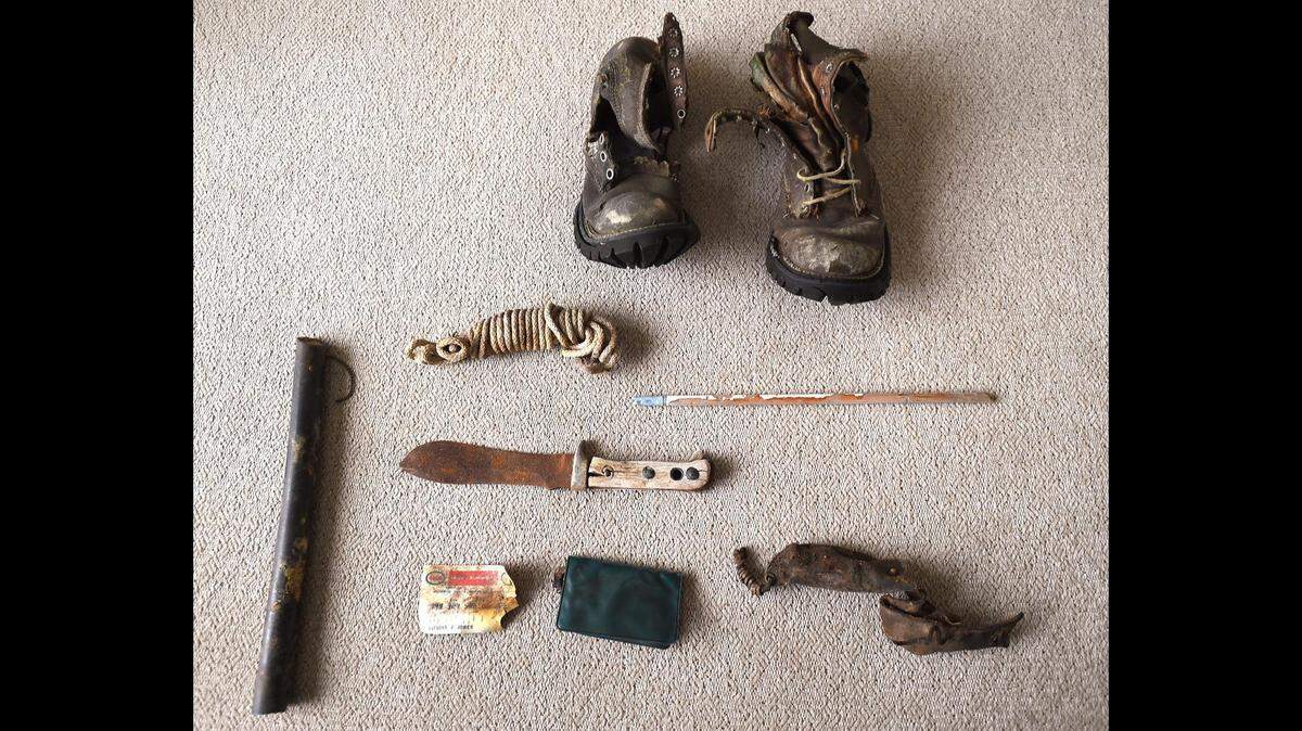 Jeff Jones arranged the boots, knife, arrow, gas card, and elk bugle found with the remains of his father. The soles of the Italian-made boots were in amazingly good condition.