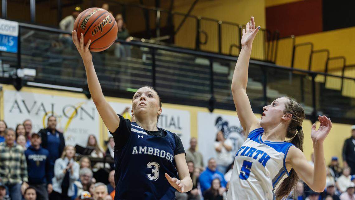 Ambrose sophomore Bryley Tadman shoots as Firth junior Baylie Mecham defends during their 3A state tournament semifinal game Friday at Kuna High School.
