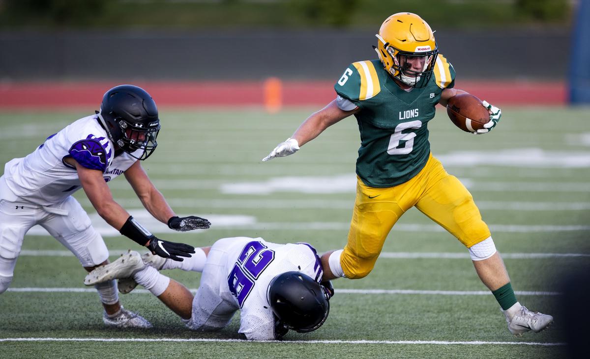 Borah running back Cameron Pruitt slips free of a tackle earlier this season at Dona Larsen Park.