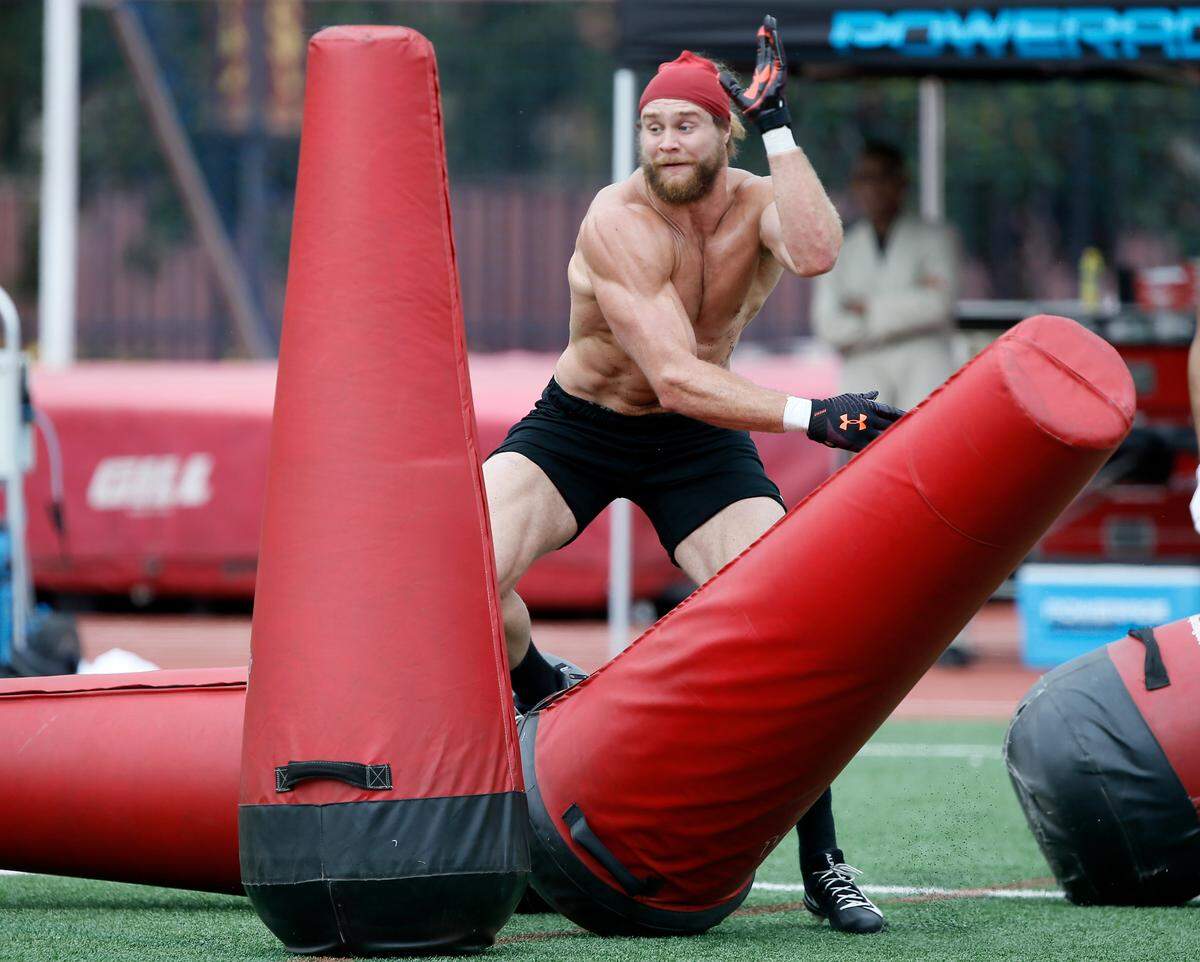 Southern California linebacker Porter Gustin works through a drill during USC Pro Day, Wednesday, March 19, 2019, in Los Angeles. The Pro Day is intended to showcase talent to NFL scouts for the upcoming draft. (AP Photo/Alex Gallardo)