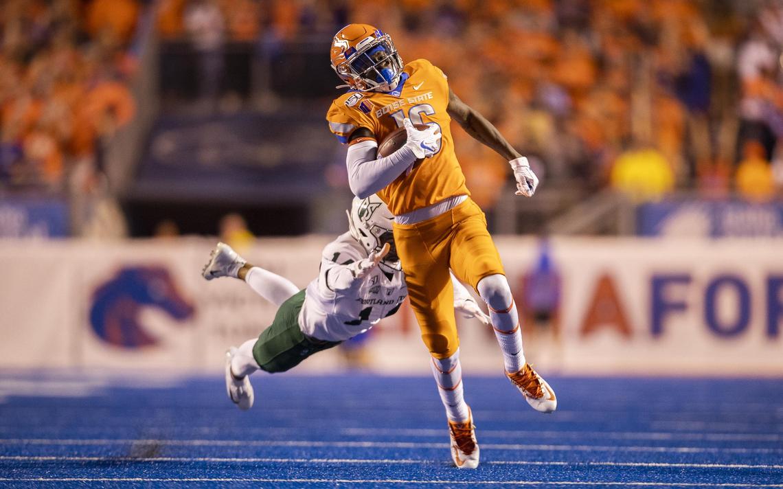 Boise State wide receiver John Hightower (16) runs for 98 yards past Portland State’s Anthony Adams (14) and the rest of the Vikings on the Broncos’ first kick off return Saturday, Sept. 14, 2019 at Albertsons Stadium in Boise.