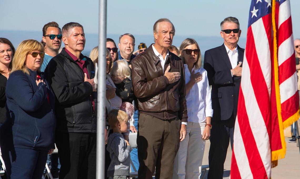 Dignitaries including Idaho Gov. Brad Little, far right, stand for the Pledge of Allegiance during a Memorial Day observance event at the Idaho Veterans Cemetery on May 29, 2021.