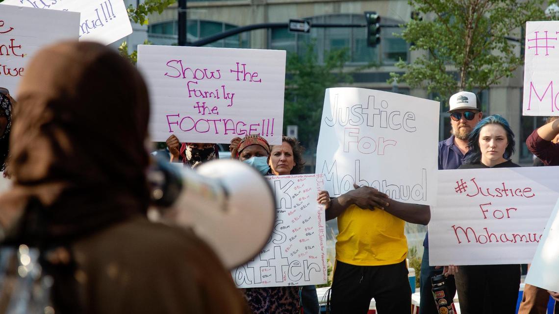 Fatuma Yussuf, a Somali refugee and family friend of Mohamud Hassan Mkoma, uses a megaphone to speak at a protest held by members of Boise’s East African community on Tuesday evening.