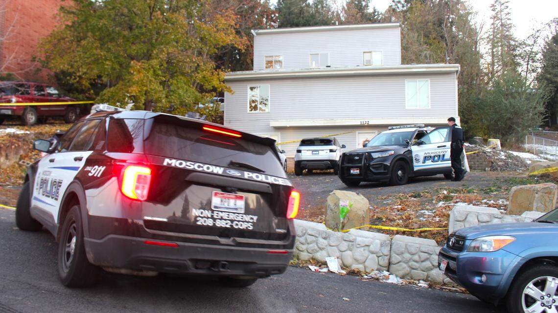 A Moscow Police Department car pulls into the driveway of the home where four University of Idaho students were stabbed to death in November 2022.