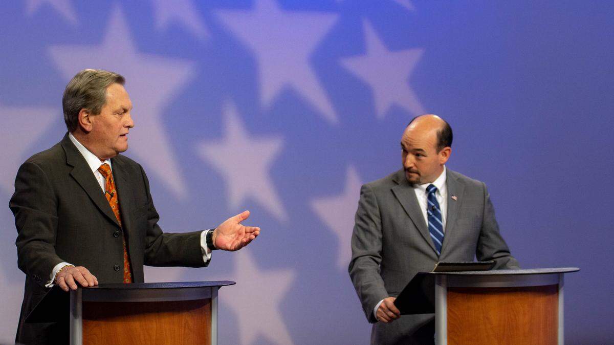 Congressman Mike Simpson, left, and challenger Aaron Swisher at the Oct. 14, 2018 debate.