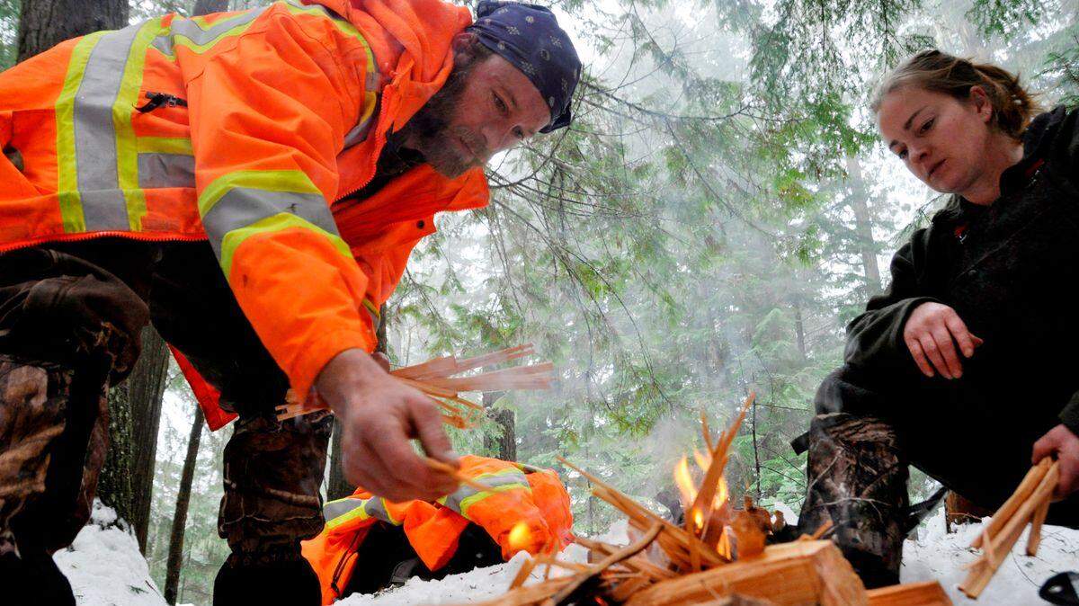 Jimmy and Leah Driver of Bonners Ferry practice fire building during a January 2015 survival training session for the Priest Lake Search and Rescue volunteers.