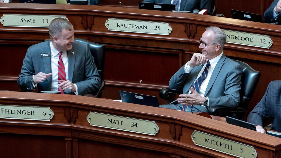 Rep. Ron Nate, R-Rexburg, right, talks with Rep. Aaron von Ehlinger, R-Lewiston, as the Idaho House of Representatives reconvened Tuesday, April 6, 2021 after a two-week recess due to a COVID-19 outbreak.