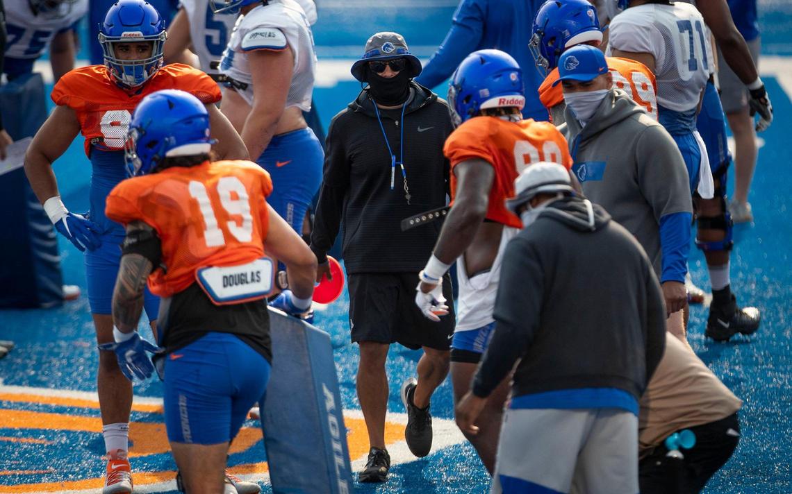 Boise State Head Football Coach Andy Avalos runs his Broncos through drills on The Blue at Albertsons Stadium Sunday, Aug. 8, 2021 during fall camp.