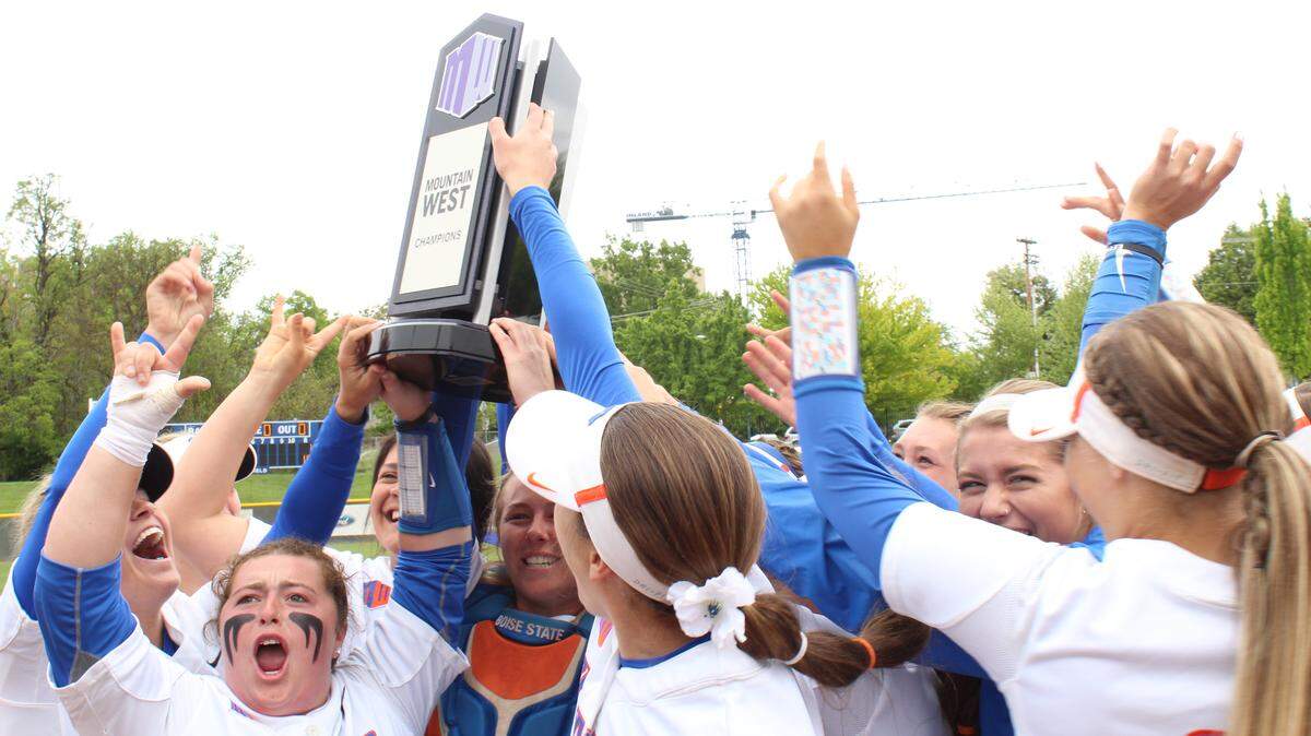 Boise State players celebrate the team’s Mountain West regular-season championship May 12 at Dona Larsen Park. It is the school’s first title.