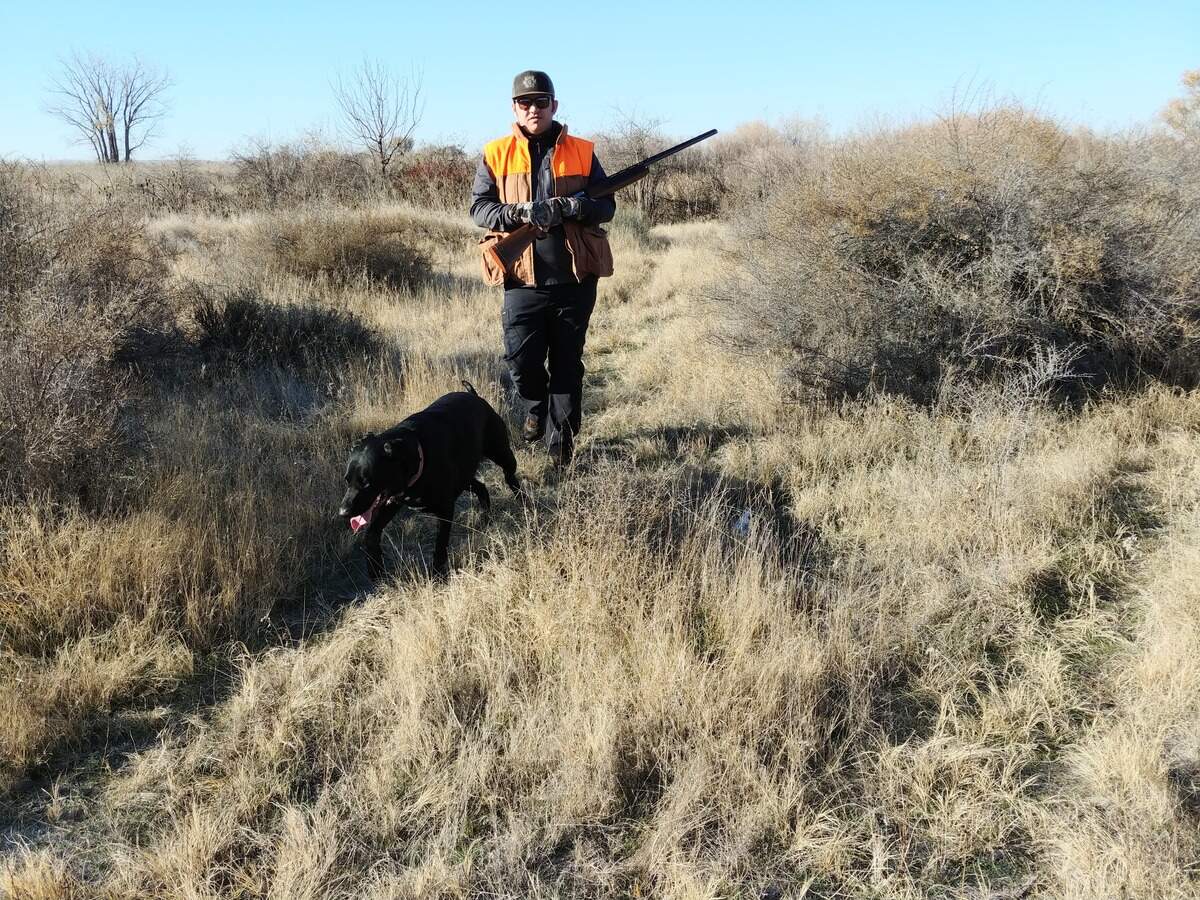 Dan Barker of Boise hunts on the Payette River Wildlife Management Area near New Plymouth with his black Labrador retriever, Ally.