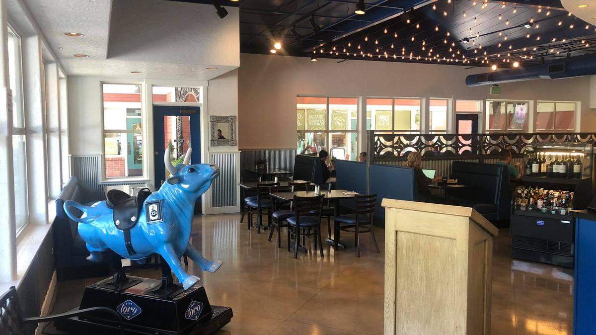 The family-friendly restaurant had a coin-operated bull for children.