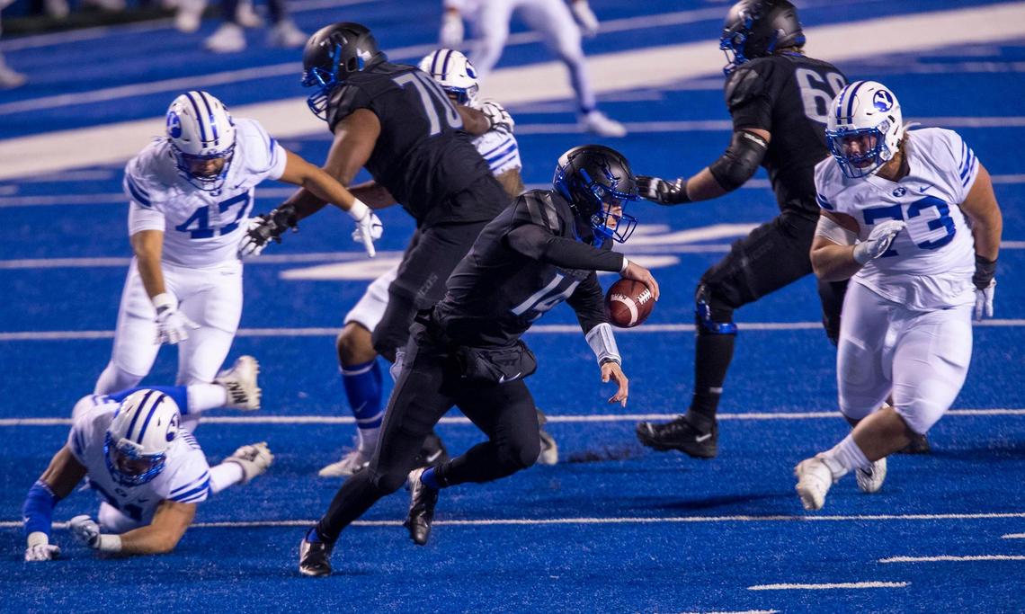 Boise State quarterback Andy Peters (14) scramble under pressure from BYU’s pass rush in the third quarter Friday, Nov. 6, 2020 at Albertsons Stadium in Boise.