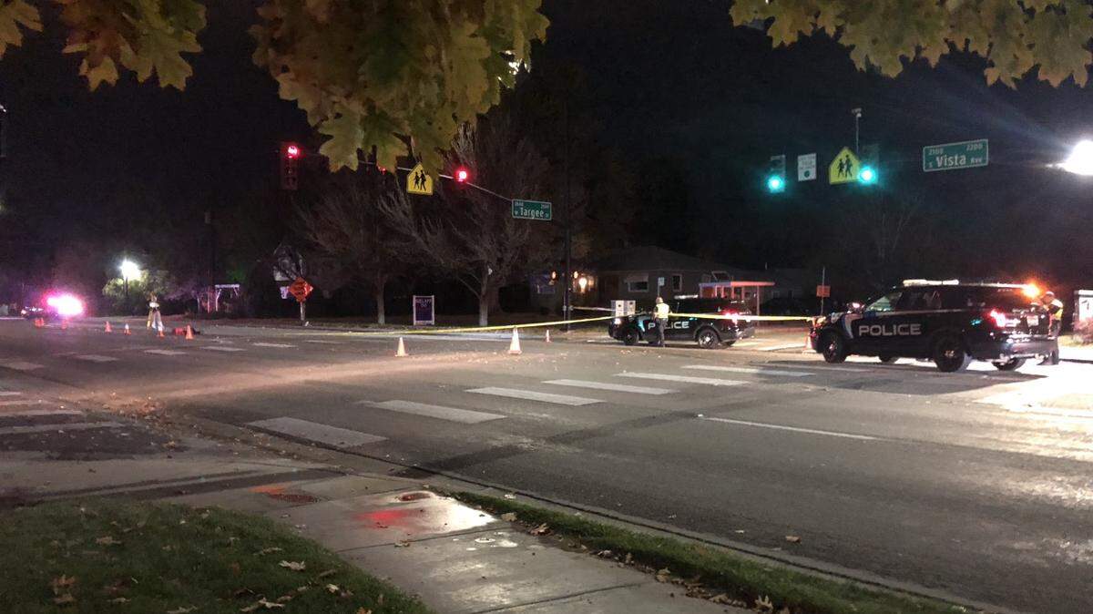 Crash reconstructionists take measurements at the scene of where a car struck and killed a pedestrian Wednesday night, Oct. 24, 2018. This view is from the south side of Targee Street at the intersection with Vista Avenue in Boise.