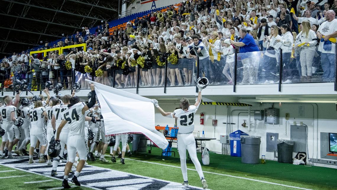 Kuna shares the 4A state football championship banner with fans after the Kavemen defeated Blackfoot 49-35 Saturday, Nov. 23, 2019 at Holt Arena in Pocatello.