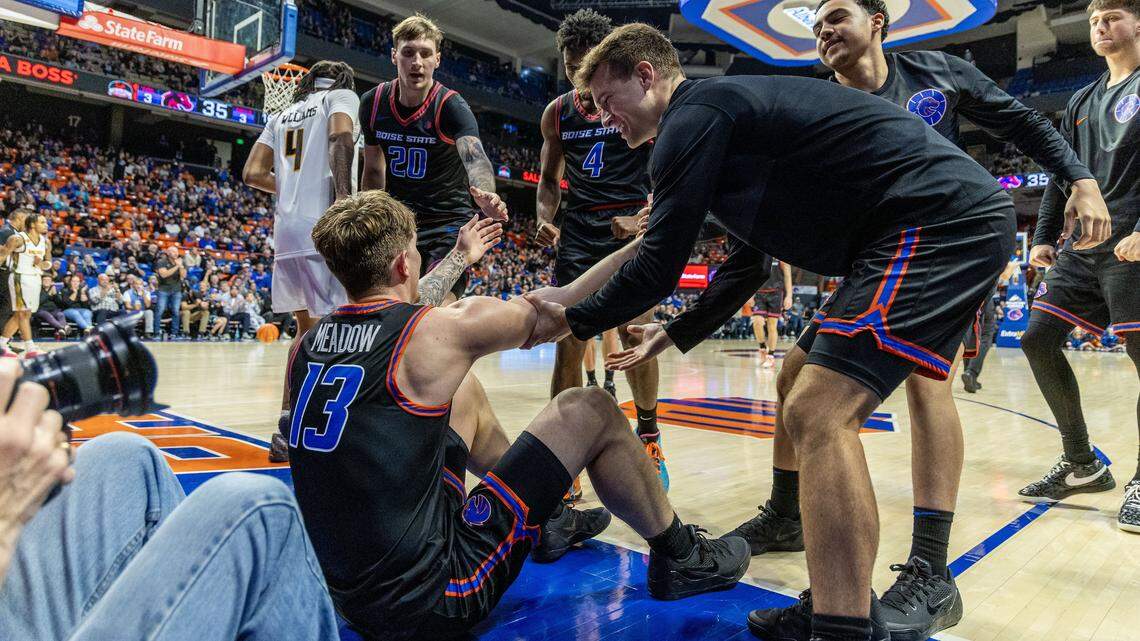 Boise State forward Andrew Meadow gets help up after being fouled by Wichita State guard TJ Williams in the second half at ExtraMile Arena in Boise, Tuesday, Nov. 18, 2025.